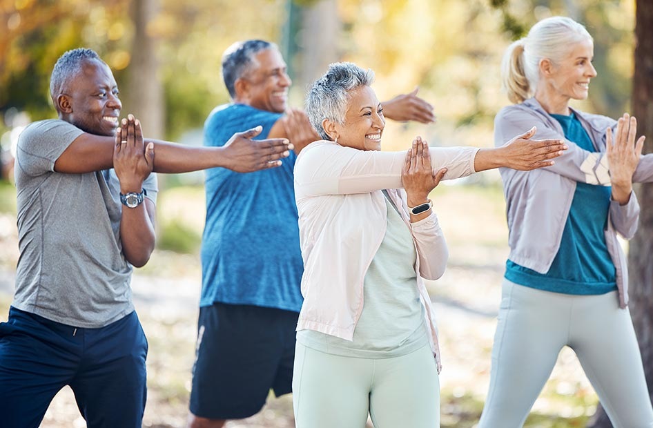 senior group exercising outdoors